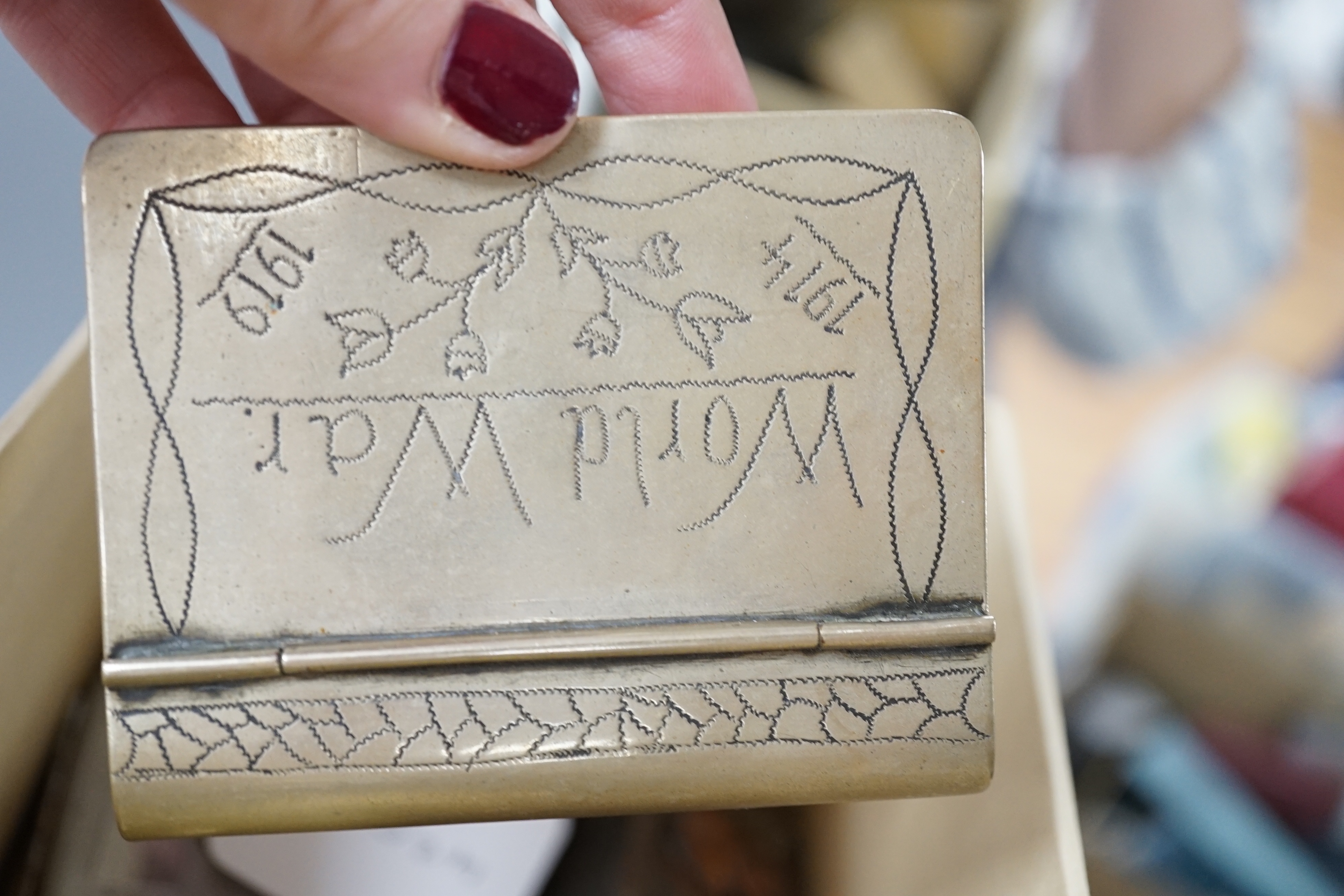 A collection of trench art and military vestas and matchbox holders